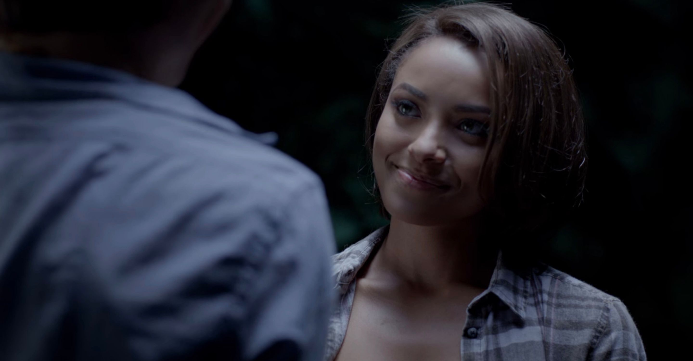 Bonnie smiling at Damon in The Vampire Diaries.