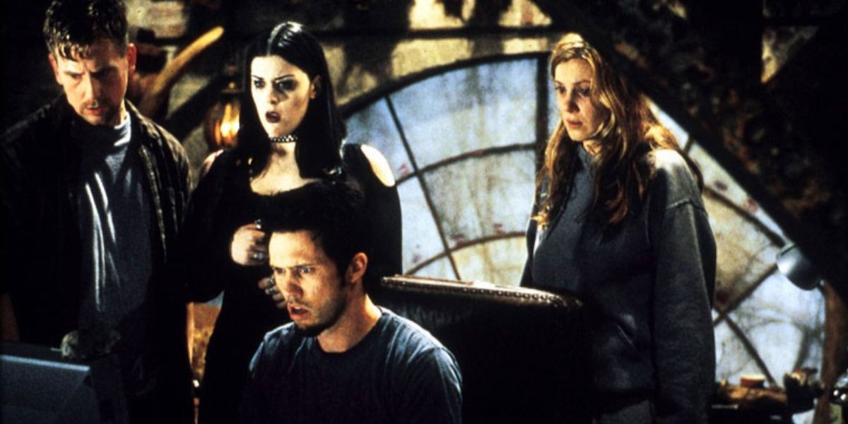 The cast of Book of Shadows: Blair Witch II surrounding a computer.