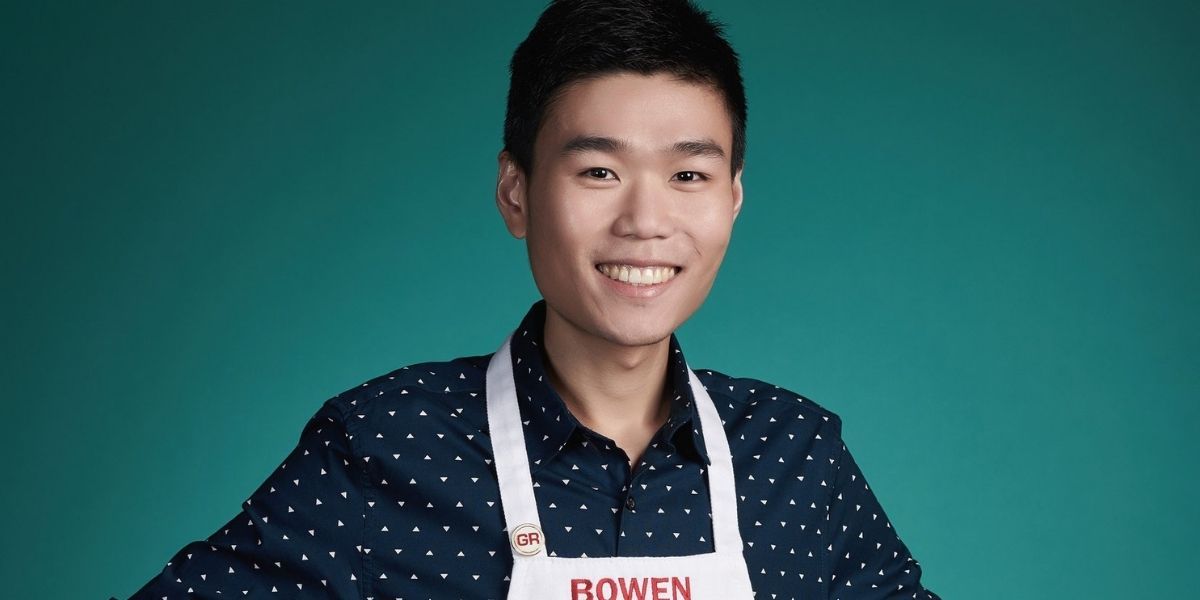 Bowen Li wearing an apron and posing for a promotional photo for Masterchef.