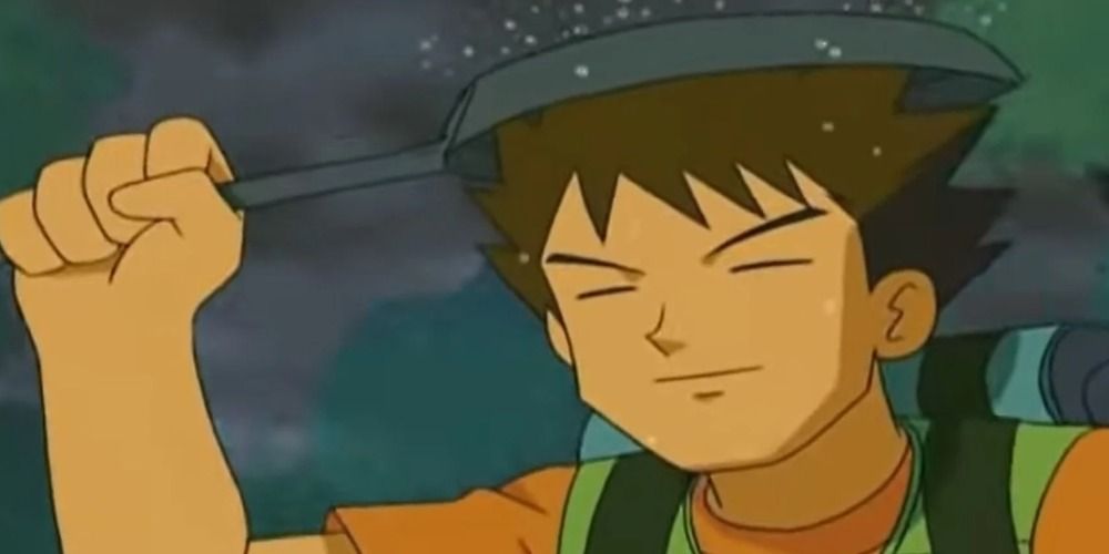 Brock from Pokemon holding a frying pan over his head