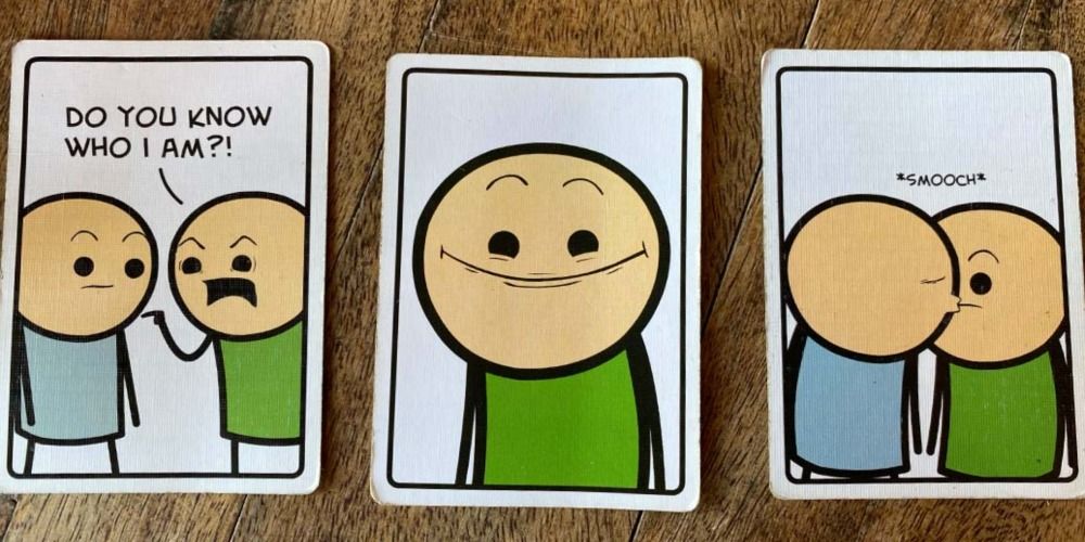 A few cards on a wood table from Joking Hazard