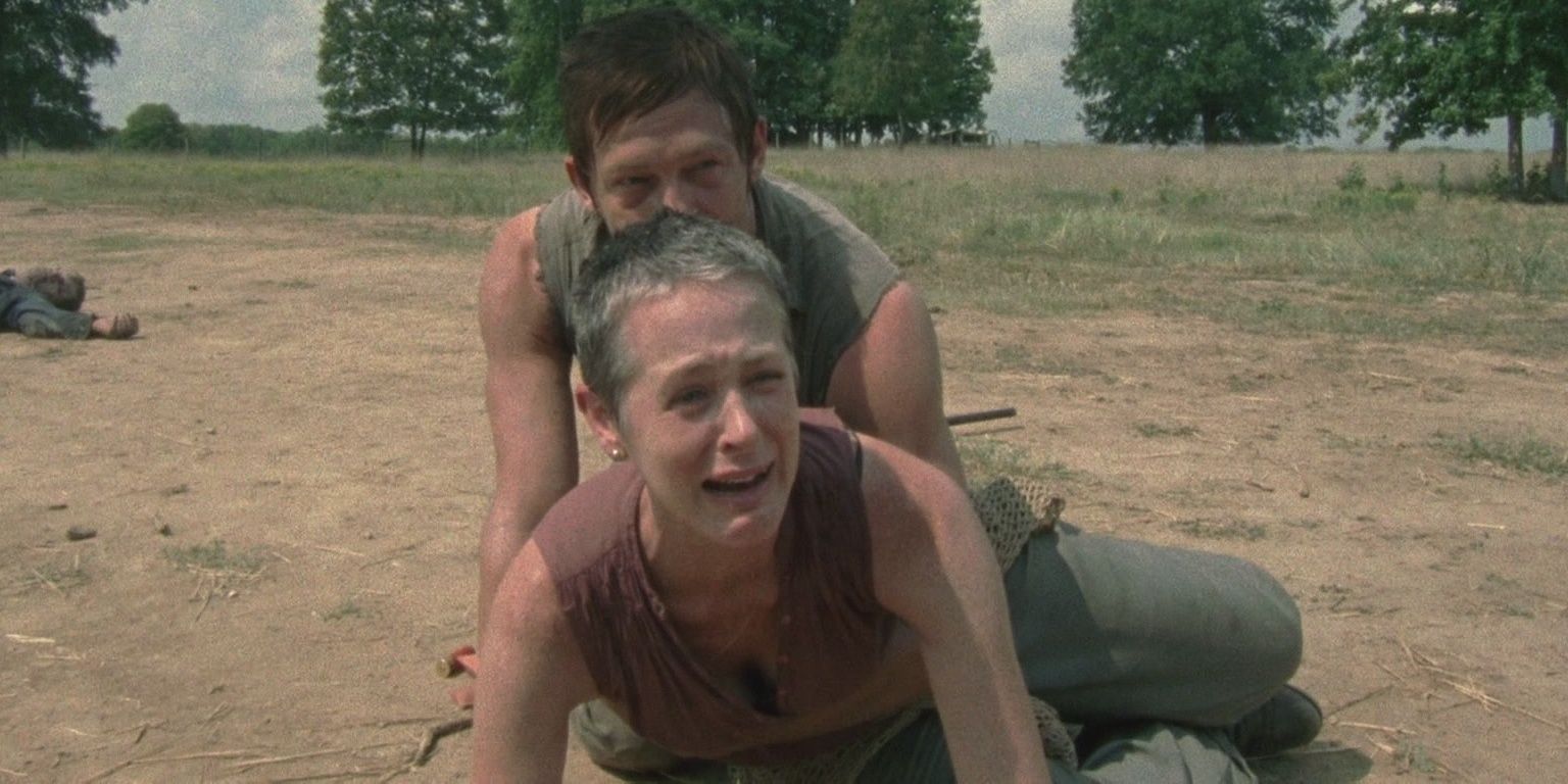 Daryl holds a crying Carol back from Sophia in The Walking Dead