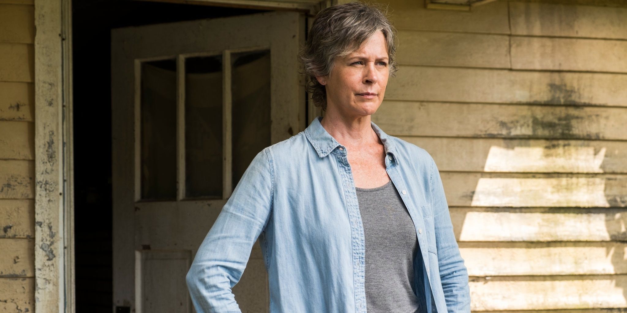 Carol stands with hands on hips in The Walking Dead
