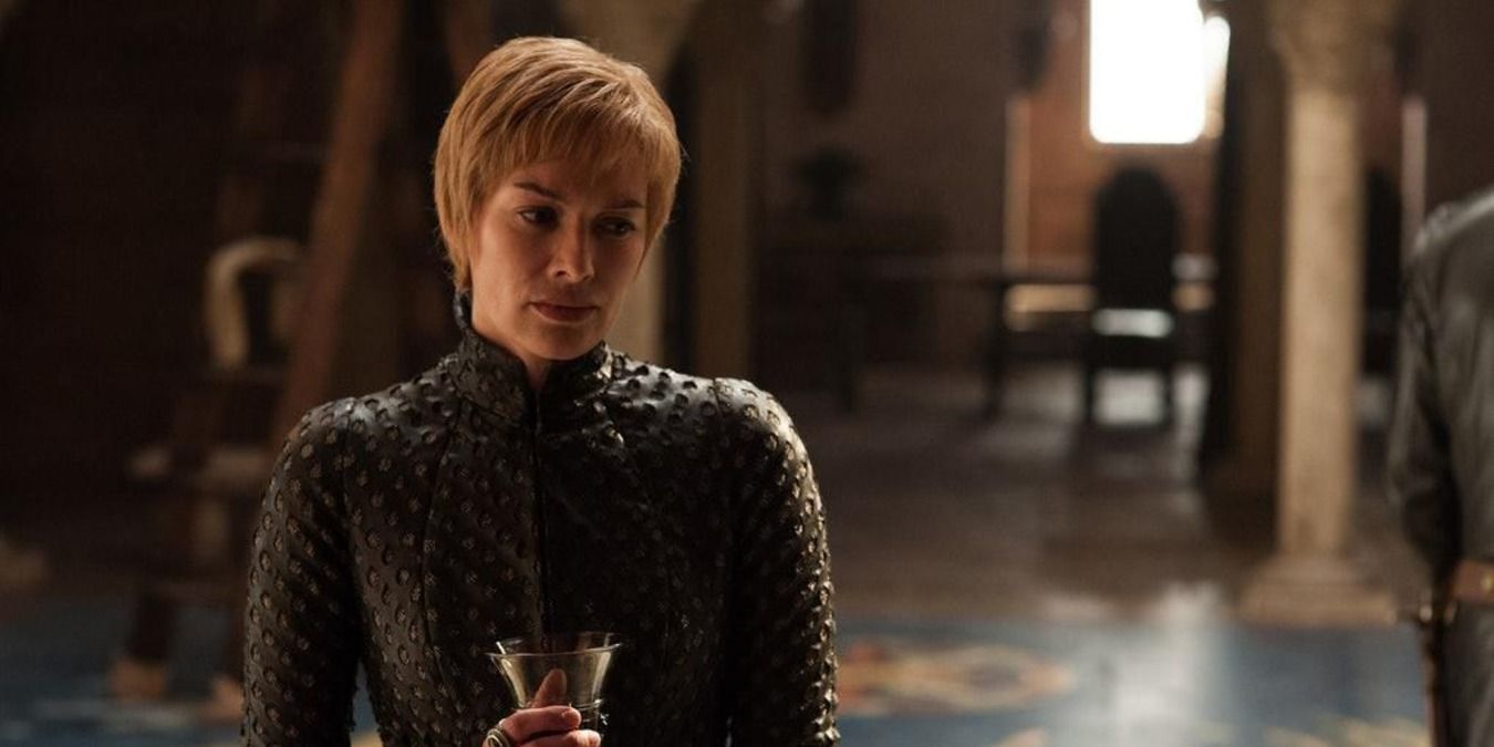 Cersei holding a glass of wine in the red keep in Game Of Thrones