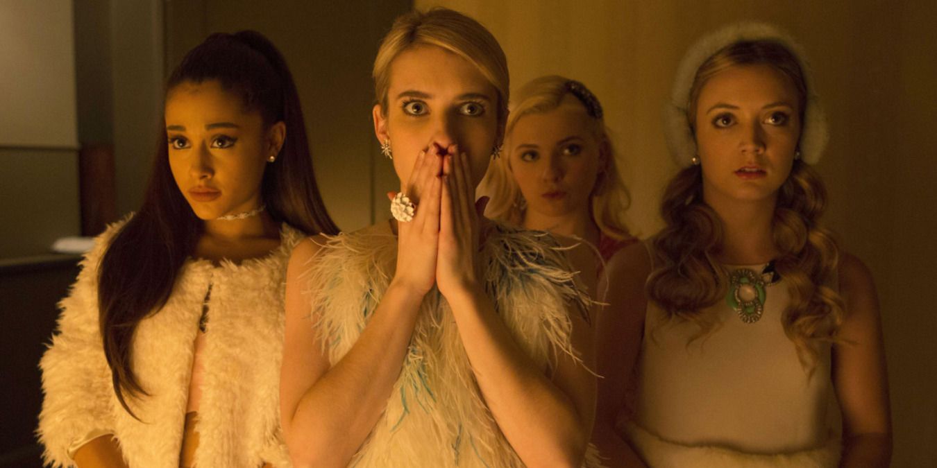 Chanel and her group standing in the house, looking scared and shocked in Scream Queens