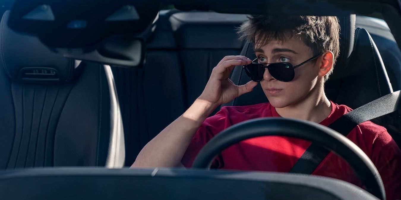 Charlie in Steve's car, looking in the rearview mirror with the sunglasses in Dead To Me