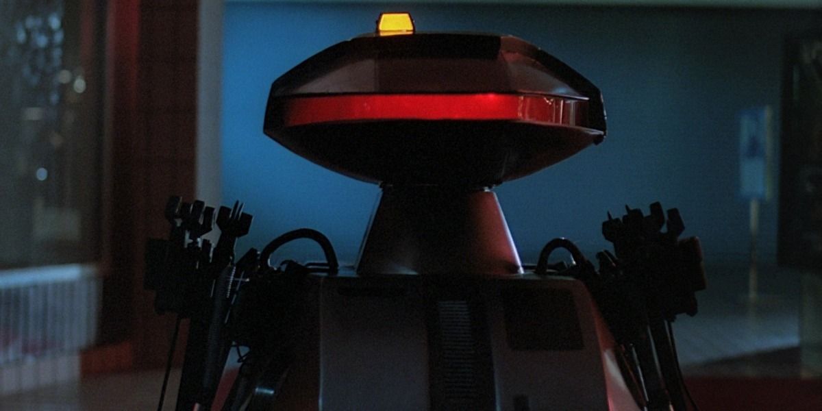 The robots from Chopping Mall glow in the darkness.