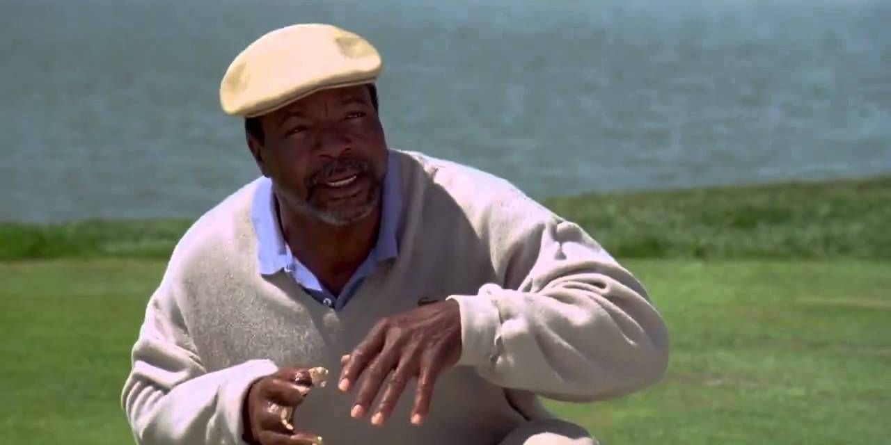 Chubbs kneeling down on the golf course in Happy Gilmore