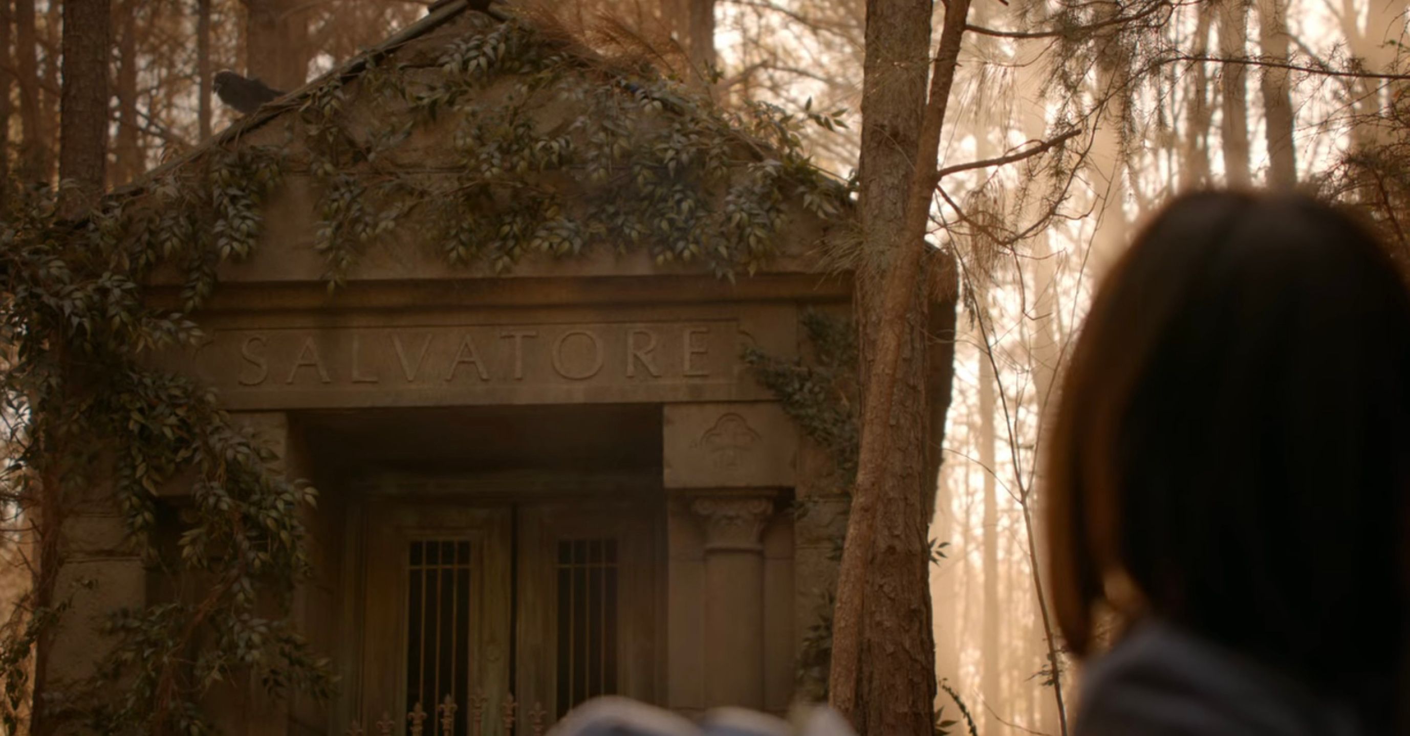 Elena writing in the graveyard in The Vampire Diaries.