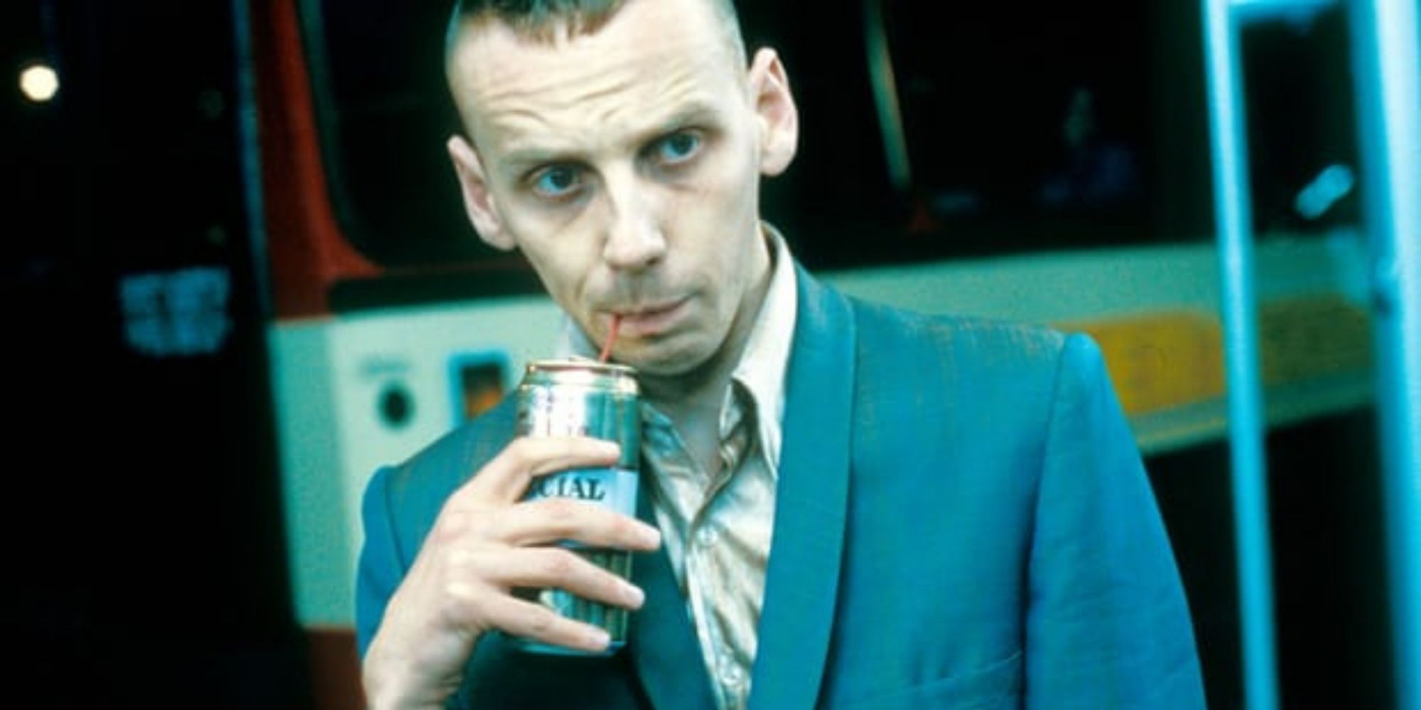 Spud drinking from a can with a straw in Trainspotting