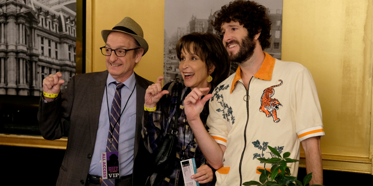 Lil Dicky poses with his parents in FXX's Dave.