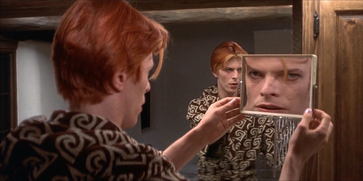 David Bowie looking at his reflection in The Man Who Fell to Earth