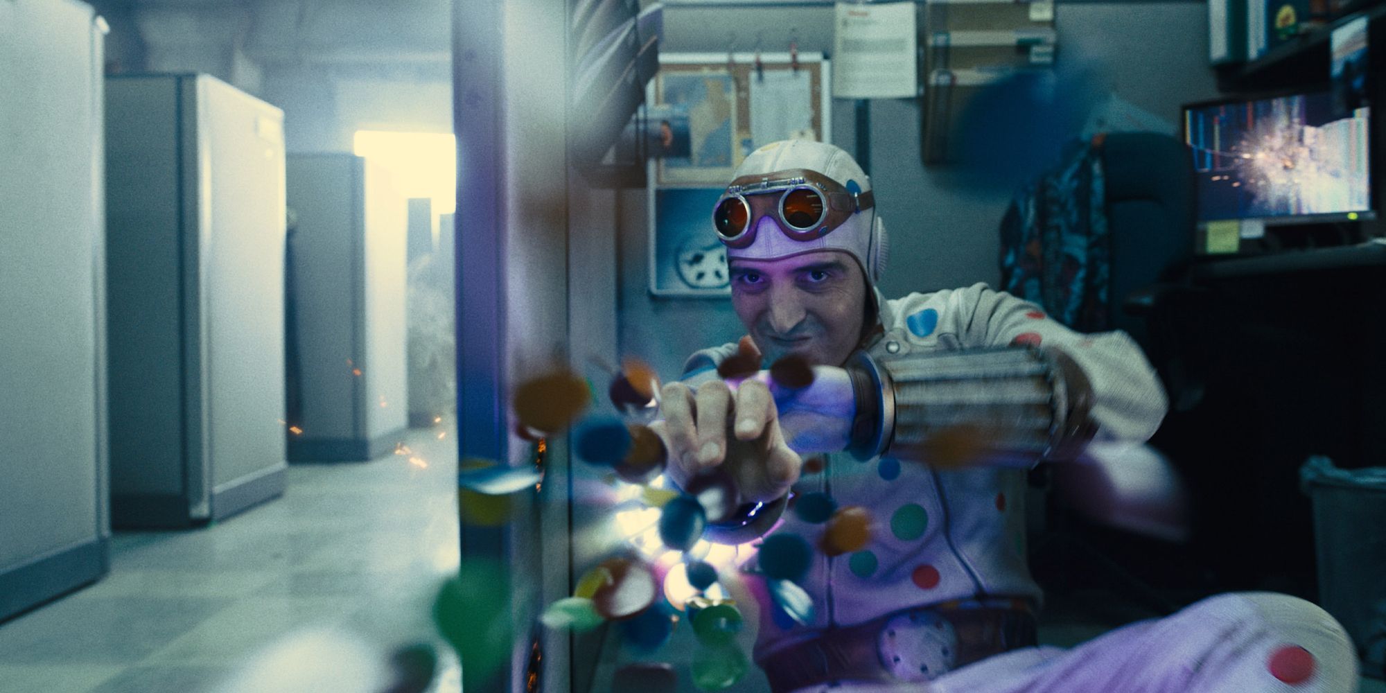 Polka Dot Man fires polka dots in an office In The Suicide Squad