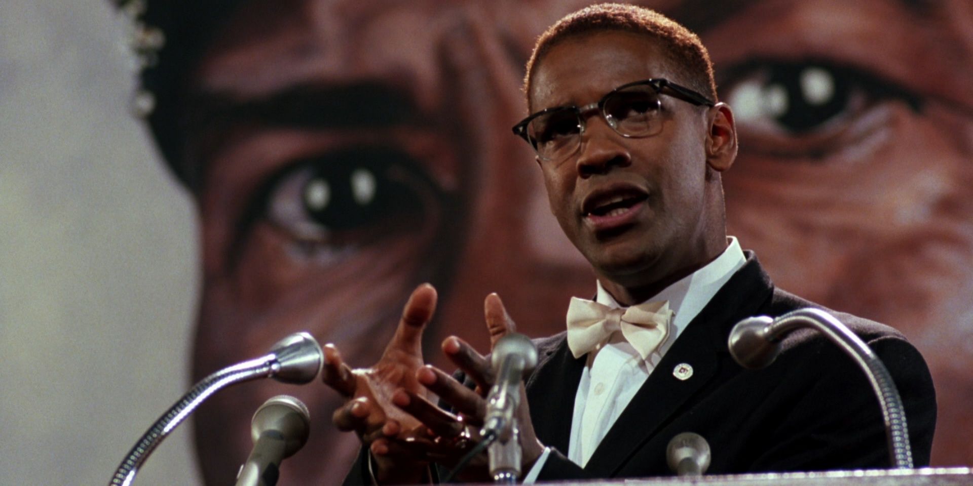 Denzel Washington as Malcolm X speaking on a podium in Spike Lee's biographical film Malcolm X