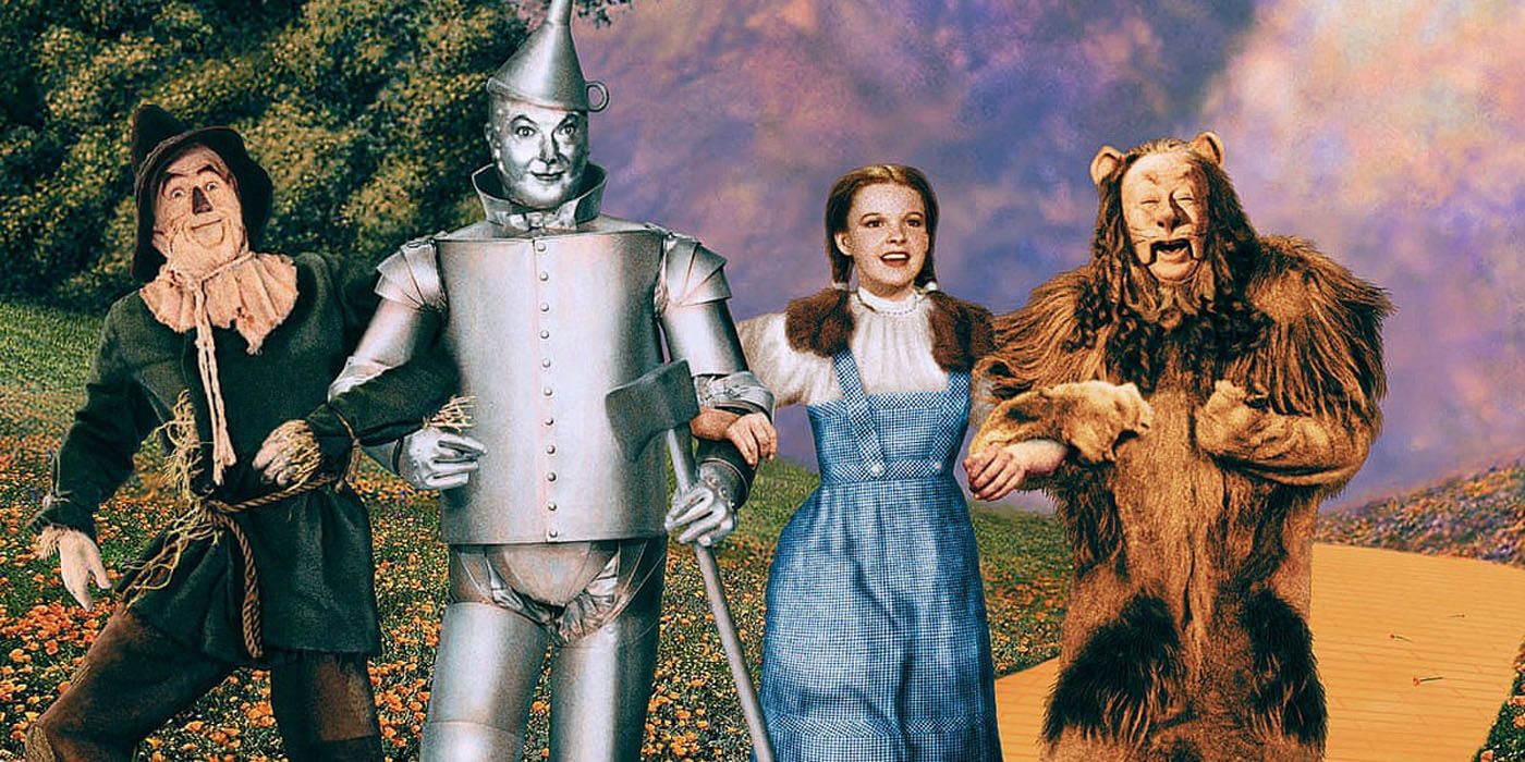 Dorothy, Scarecrow, Tin-Man, and Cowardly Lion on the Yellow Brick Road in The Wizard of Oz.