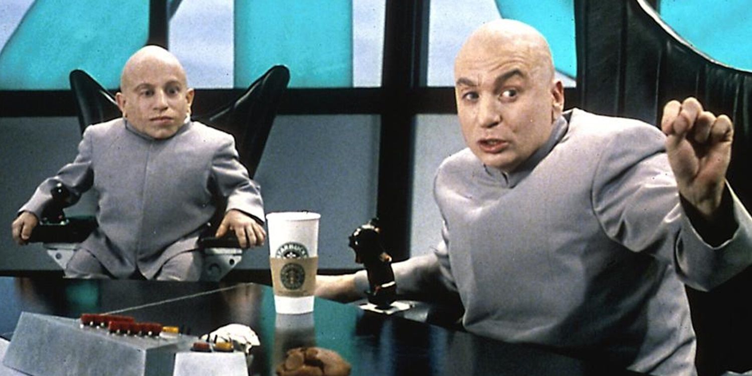 Dr Evil and Mini Me sit at a large table in Austin Powers The Spy Who Shagged Me