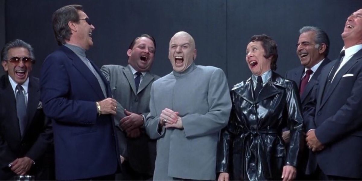 Dr.Evil laughing surrounded by henchmen in Austin Powers