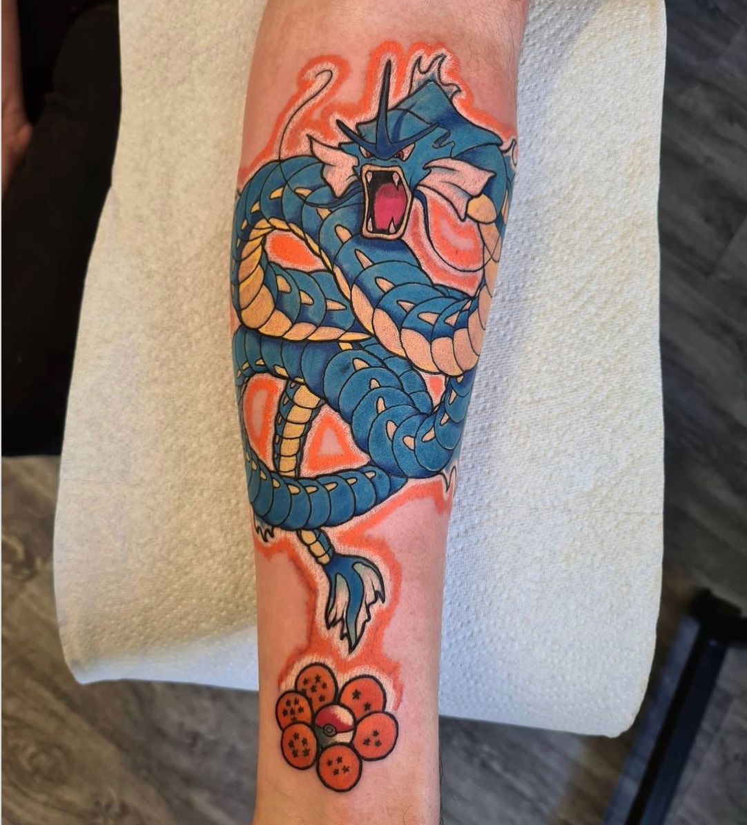 Tattoo of Gyarados hovering over the dragon balls