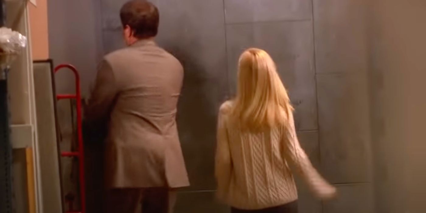 Dwight and Angela walking into the warehouse on The Office