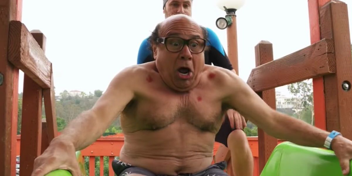 Frank and Charlie on a water slide in It's Always Sunny