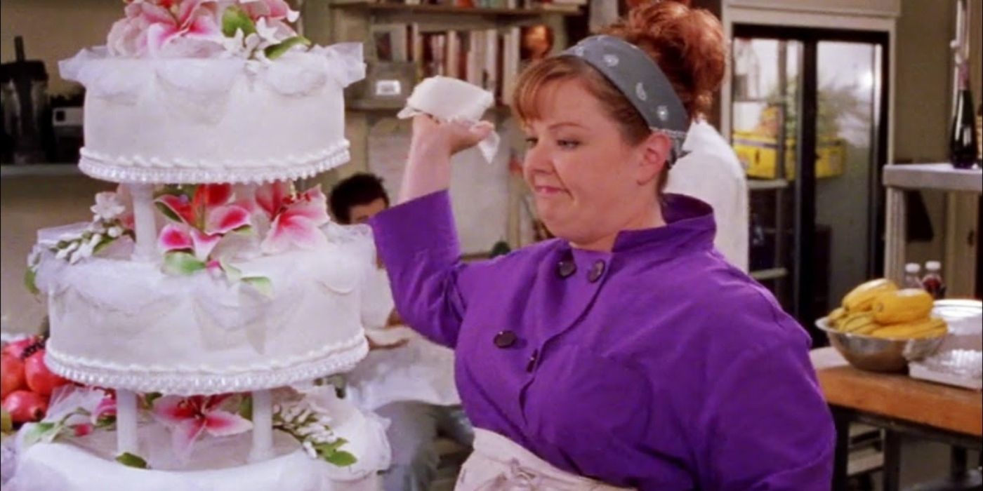 Sookie staring at the wedding cake she made for Lorelai in the inn's kitchen on Gilmore Girls