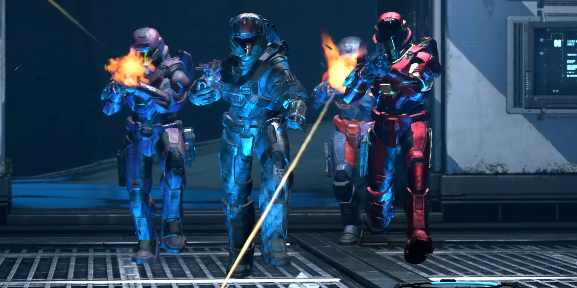 Group of four players shooting in Halo, moving towards the screen in Team Slayer mode.