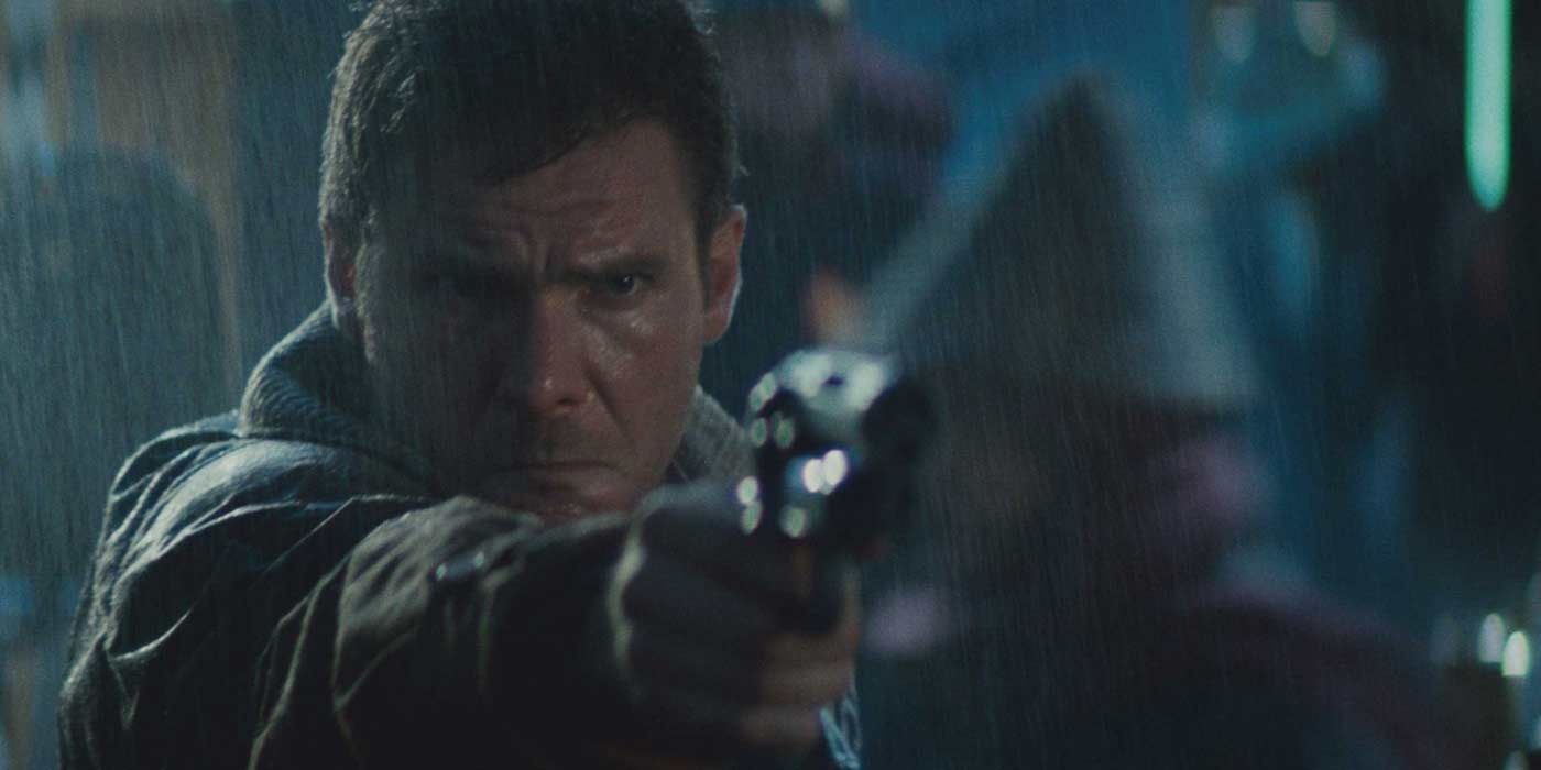 Harrison Ford as Rick Deckard holding a gun in Blade Runner