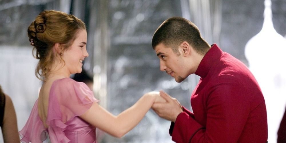 Hermione Granger and Viktor Krum from Harry Potter in Yule Ball attire, Viktor kisses Hermione's hand