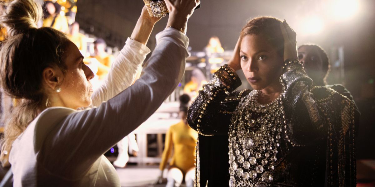 Assistant helping Beyoncé with costuming in Homecoming