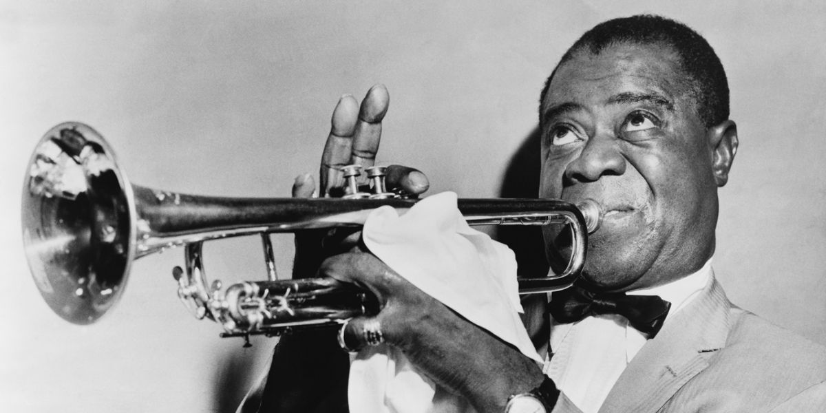 Black and white image of Louis Armstrong playing trumpet in Jazz documentary