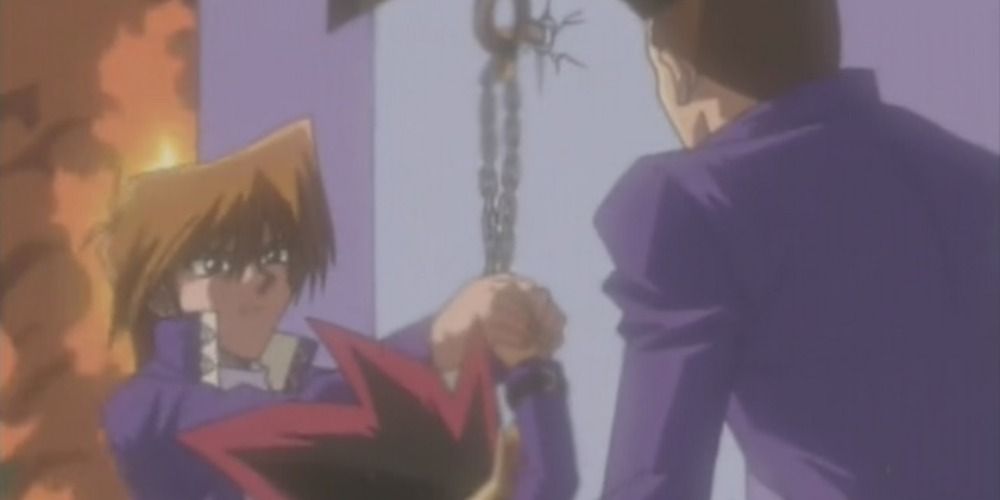 Joey and Tristan saving Yugi from a fire in the Yu-Gi-Oh! anime.
