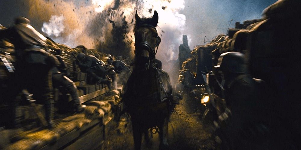 Joey galloping through the trenches with an explosion behind him in War Horse (2011)