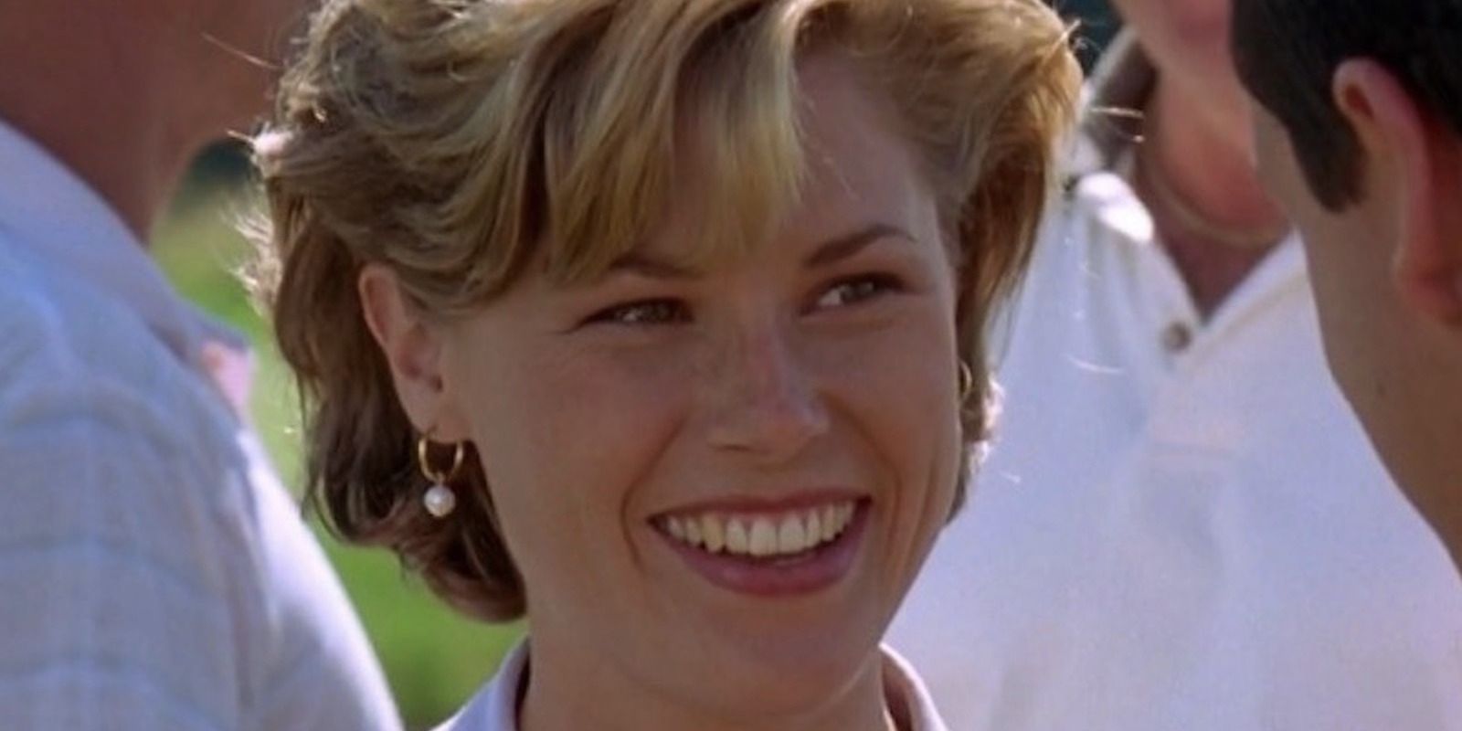 Julie Bowen as Virginia Venit smiling in Happy Gilmore
