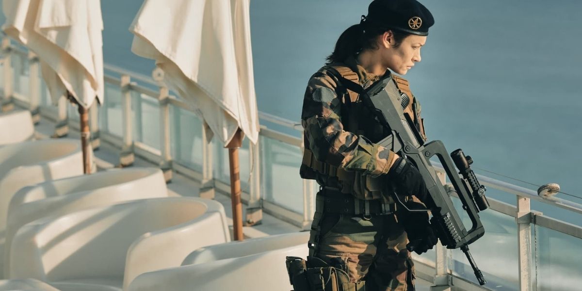 Kalra in her military uniform holding a gun