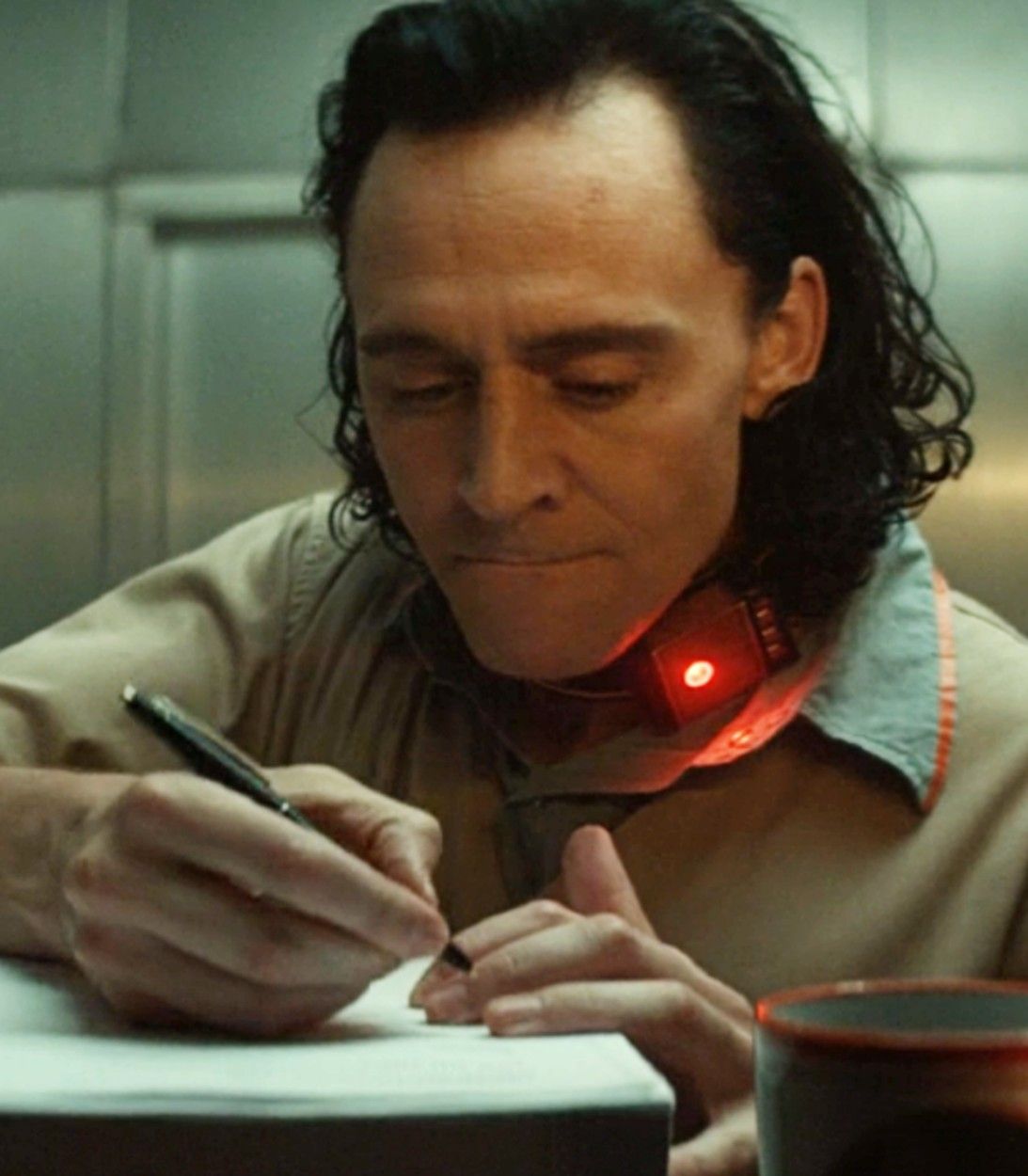 Loki Episode 1 Loki Signing Paperwork Vertical