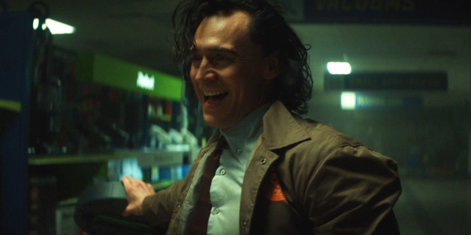 Loki smiles and looks off screen in the Disney+ series
