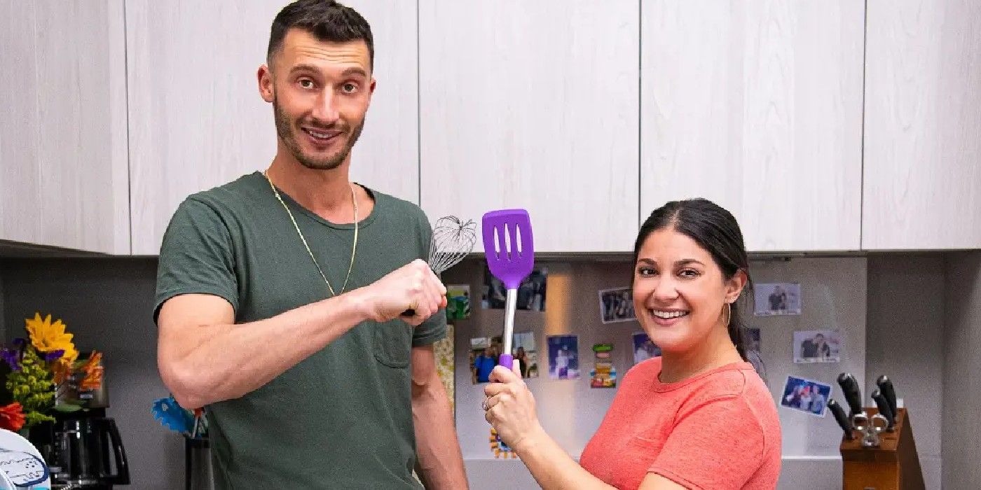 Alexei and Loren Brovarnik from 90 Day Fiancé posing for the camera in kitchen