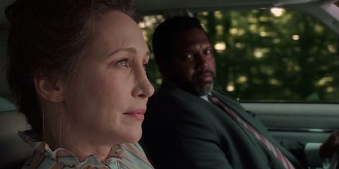 Lorraine sits in a car with Sergeant Clay in The Conjuring The Devil Made Me Do iT