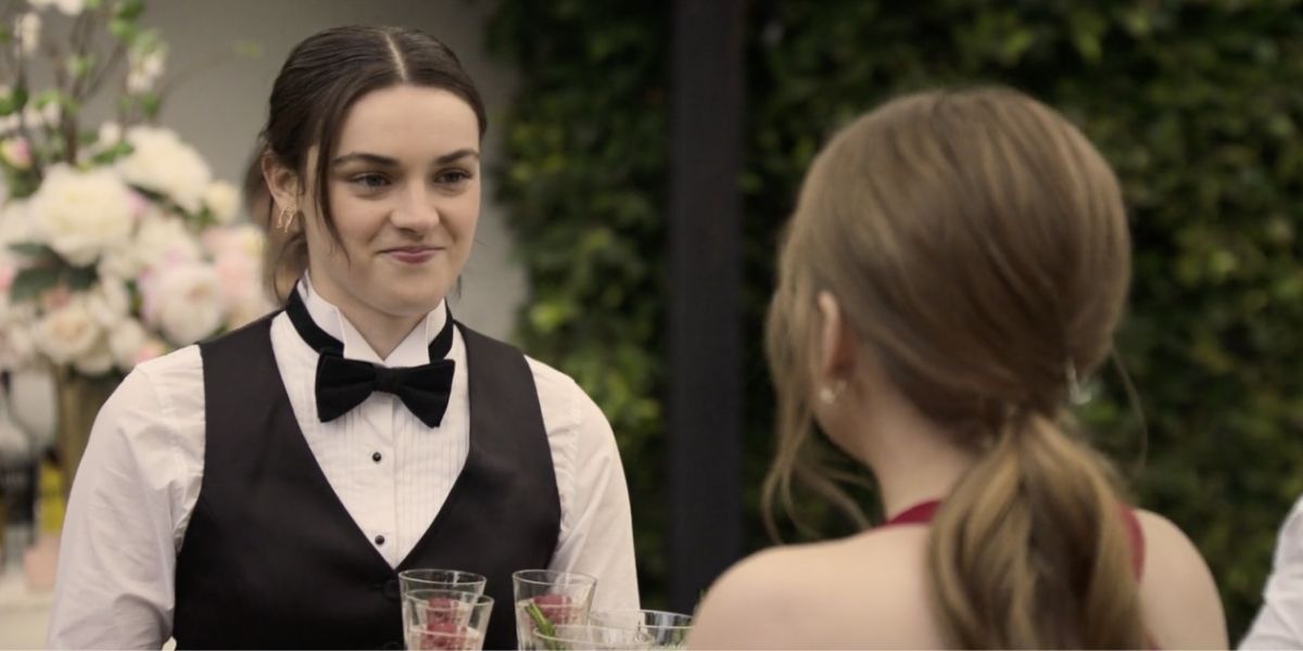 Lucy talking to Lake at the wedding