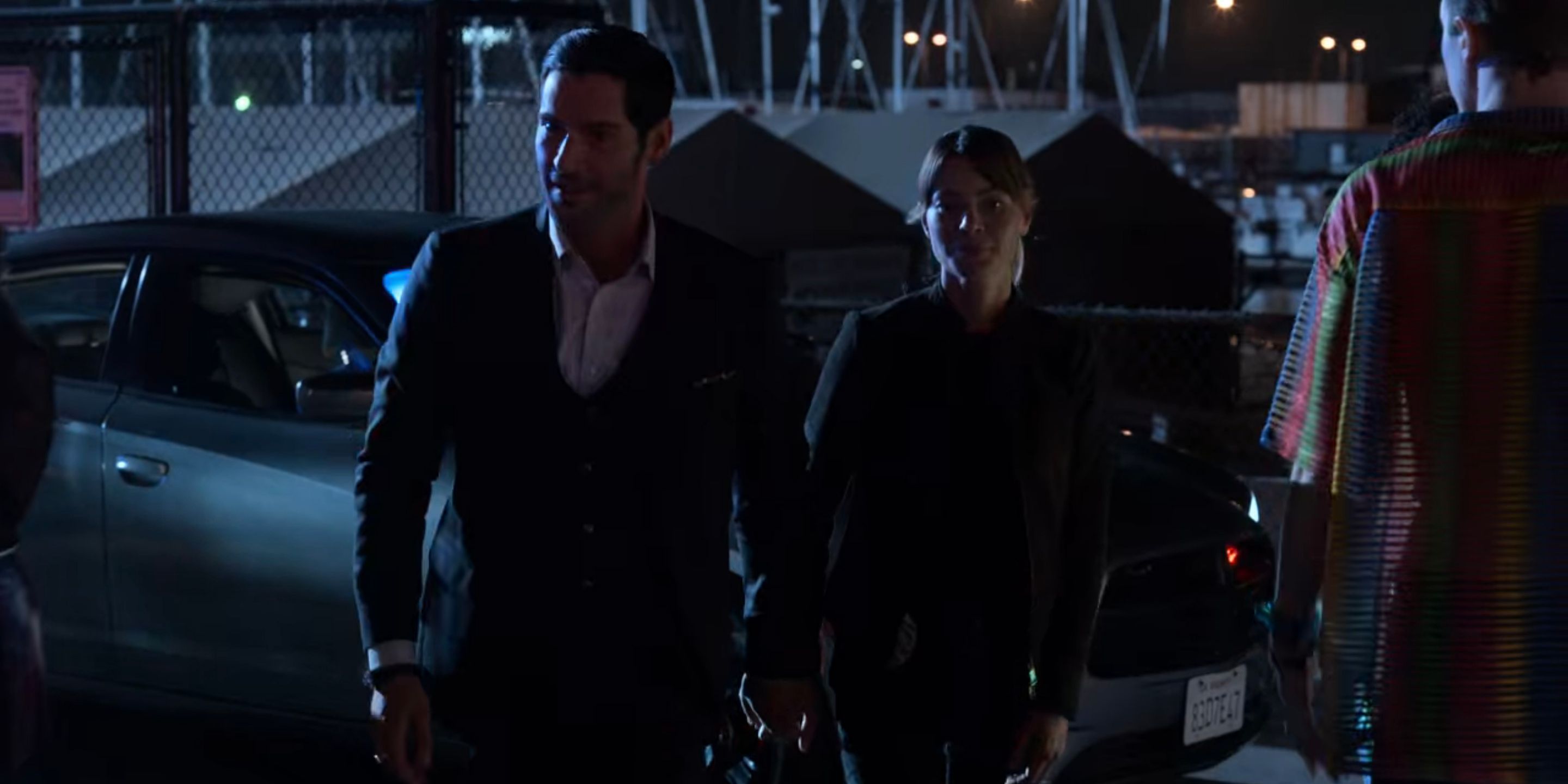 Lucifer and Chloe hold hands.