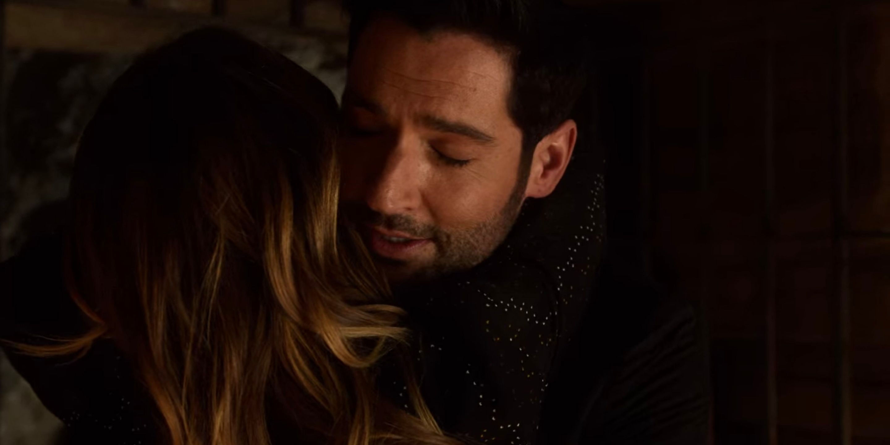 Lucifer rescues Chloe and they hug.