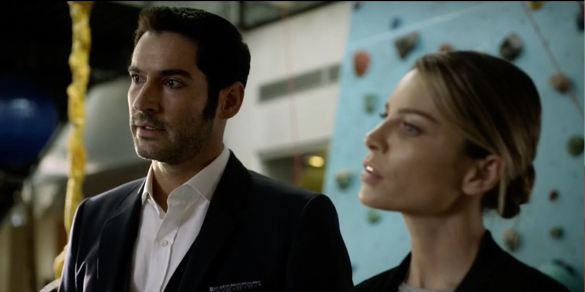 Lucifer and Chloe standing side by side at a video company in Lucifer.