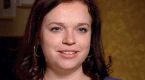 Madison Brown Sister Wives Smiling in close up with brown background