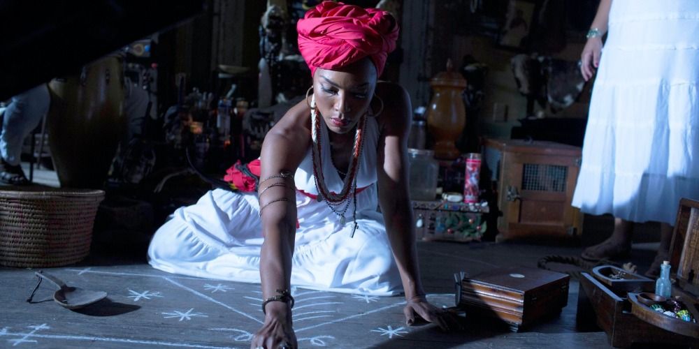 Marie Laveau drawing shapes onto the ground in AHS Coven