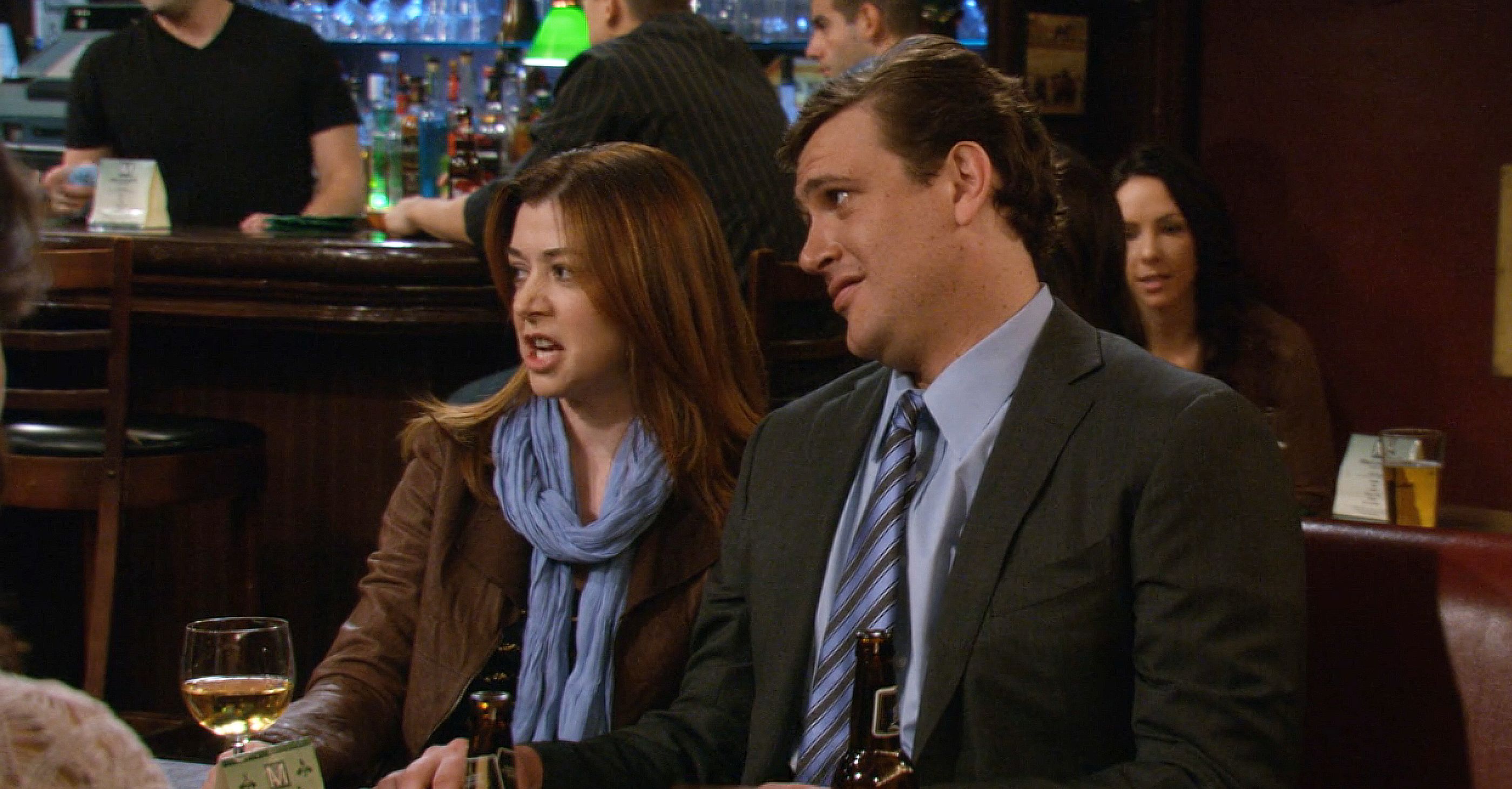 Marshall and Lily sitting in the bar in How I Met Your Mother.