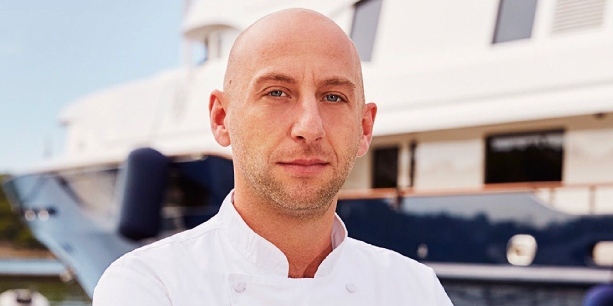 Below Deck Med's Mathew Shea in front of boat for promo pic