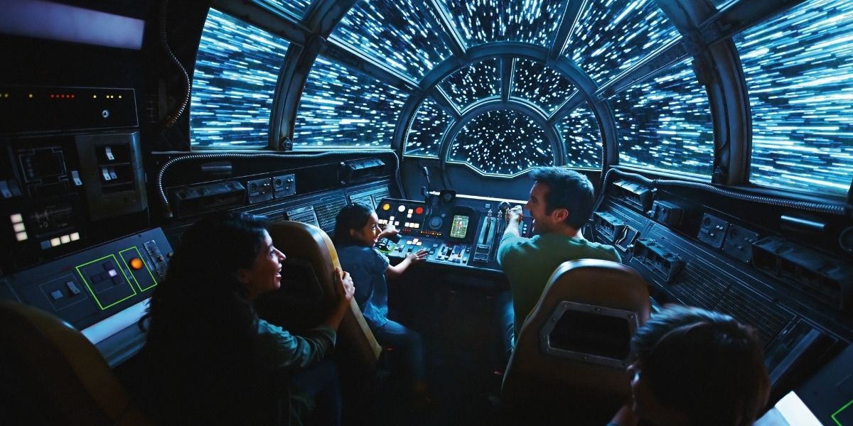 An image of a family aboard the Millennium Falcon Smuggler's Run at Galaxy's Edge