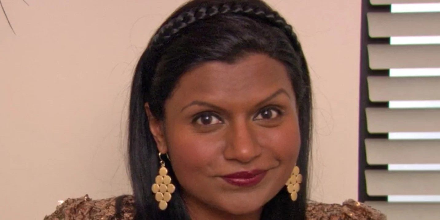 Kelly Kapoor smiling for the camera in The Office