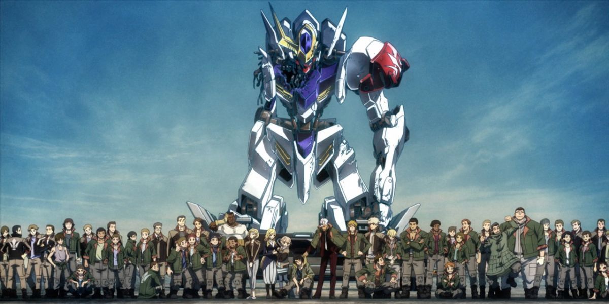 The members of Tekkadan lined up in front of Gundam Barbatos.