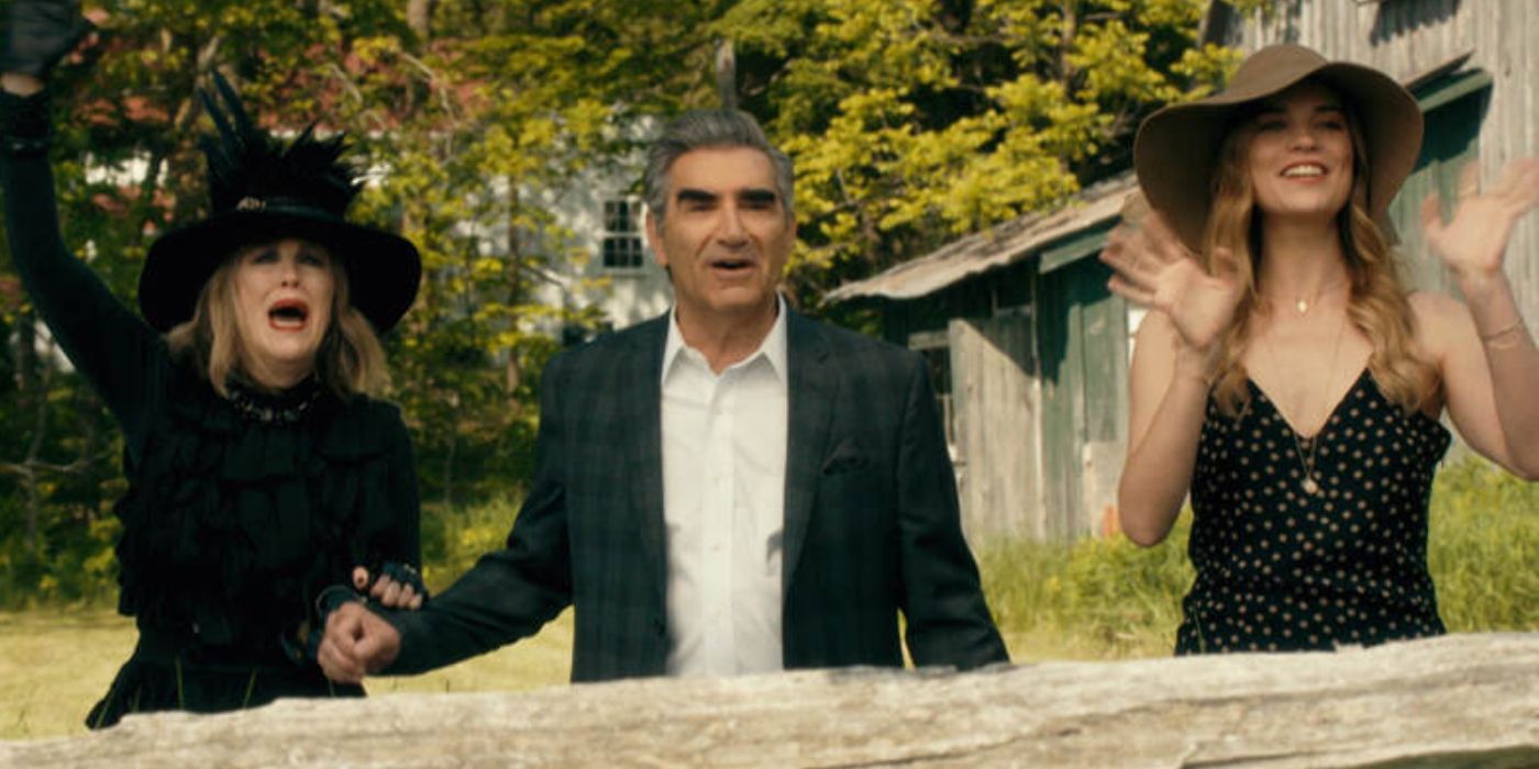 Moira, Johnny, and Alexis cheerfully looking at David on a farm in Schitt's Creek
